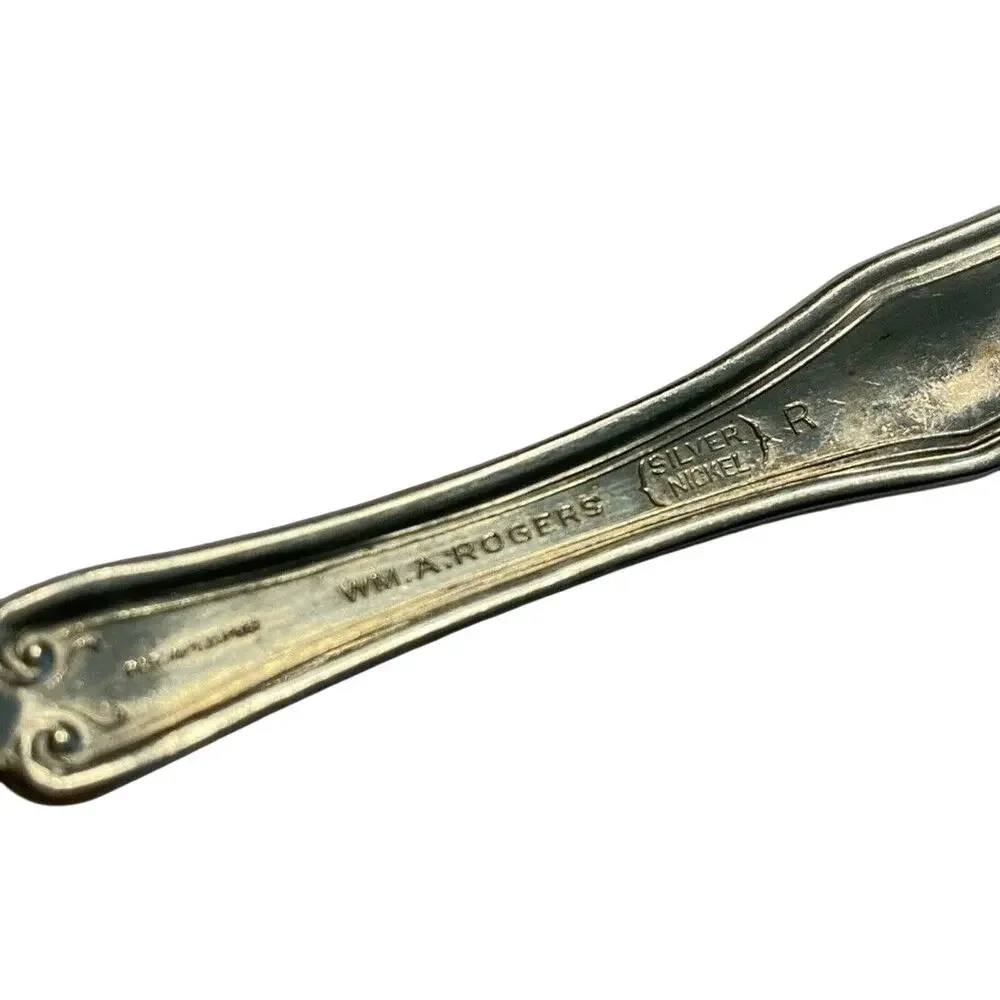 Vintage Silverplated Twisted Handle Butter Knife Early Floral by Wm A Rogers